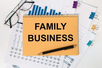Notepad with the inscription Family business, documents, pen