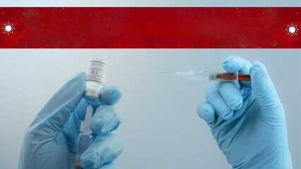 CORONAVIRUS / COVID-19 vaccination - doctor holding syringe with Corona vaccine in his hands, with empty banner