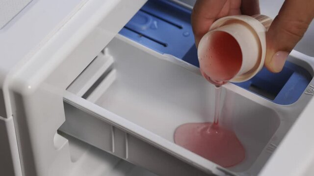 Pour some laundry detergent on the clothes and put it in the washing machine
