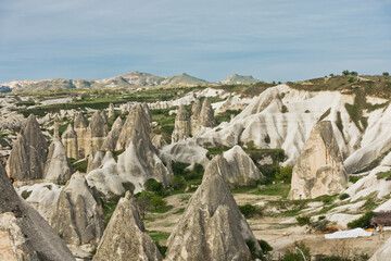 Fototapeta na wymiar Panorama with magnificent stone structures and caves near Goreme at Cappadocia, Anatolia, Turkey