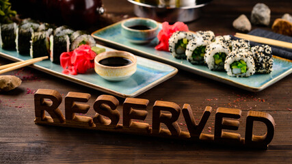 inscription is reserved on table with dish in restaurant. the inscription reserved on the table with food