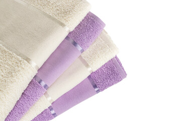 Stacked colored spa towels on white background