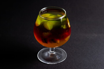 Jelly with kiwi and fruits in a cup
