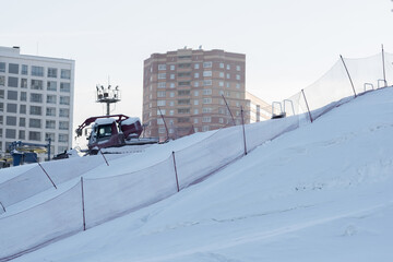 Ski trail in winter. The track in the stadium among the houses. Healthy lifestyle. Ski trail with...