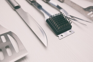 The bbq equipment on the wooden table