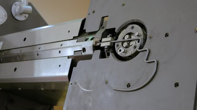 Automatic cnc wire bending machine working with metal at factory, plant - close up. Metalworking, machining, industrial, equipment, technology, manufacturing concept
