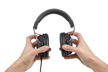 Hands Holding Headphones on White Background