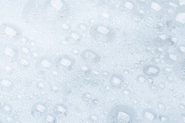 Foam bubble from soap or shampoo for washing isolated on white background from above