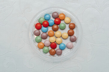 multicolored round candies on the table