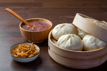 Chinese breakfast. Steamed buns and porridge are on the table