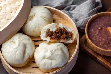 Chinese breakfast. Steamed buns and porridge are on the table