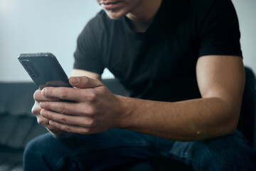 man texting message on cellphone