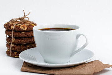 delicious cookies and a cup of coffee. Isolated on white background