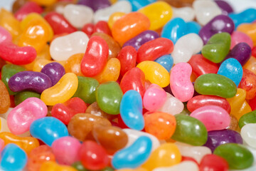 A plate of colourful Jelly Beans on a white background