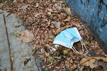 Used face mask discarded on the street