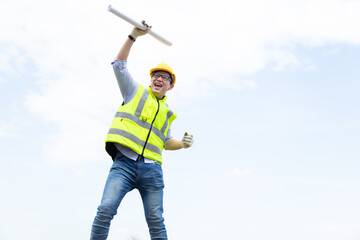 Naklejka premium Success Asian man construction worker in hardhat. Celebration victory Success winning Leadership Concept
