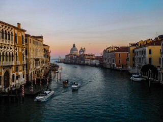 View along the grand canal Venice from the rialto bridge towards the Venetian Lagoon at sunset
