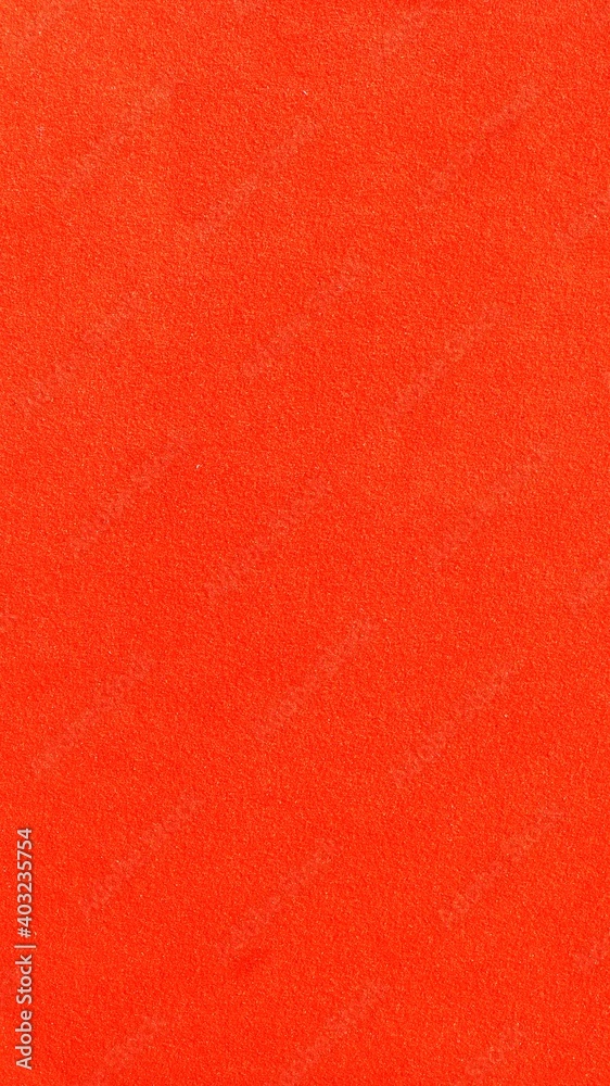 Wall mural scarlet soft bright material background full frame, empty one-color backdrop of a shade of red, fine