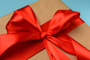 knotted bow on gift and red silk ribbon