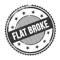 FLAT BROKE text written on black grungy round stamp.