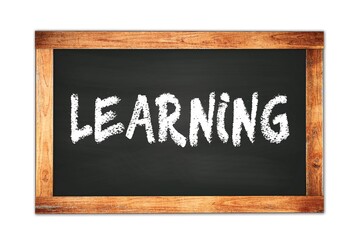 Fototapeta premium LEARNING text written on wooden frame school blackboard.