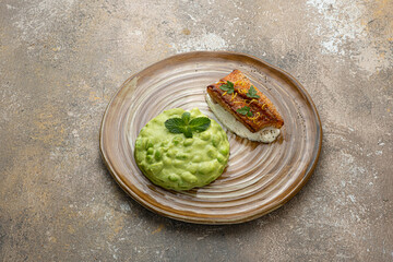 Pan fried ocean perch with snow peas puree and adamame, copy space