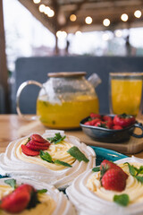 Meringue and whipped cream dessert layered with seasonal strawberry.