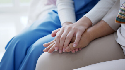 Close up hand of young asia woman or nurse home care holding senior grandmother give support...