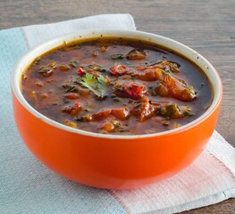 Bowl of traditional soup Borscht on table
