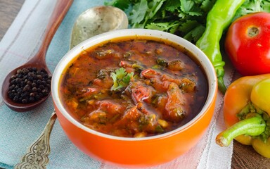 Bowl of traditional soup Borscht on table