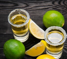 Tequila drink served in glasses with lime and salt