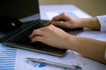 Female finance staff , Business women working at home, typing on keyboards, typing company profit reports for tomorrow morning meetings with her boss, working at home ideas