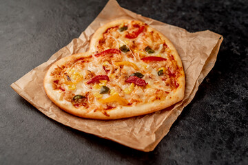 heart shaped pizza for valentine's day on stone background