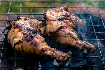 Chicken Legs Roasted On The Hot Flaming Charcoal Grill, Top View Close Up