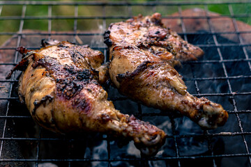 Chicken Legs Roasted On The Hot Flaming Charcoal Grill, Top View Close Up