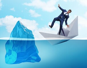 Economic crisis concept with businessman in sinking paper boat