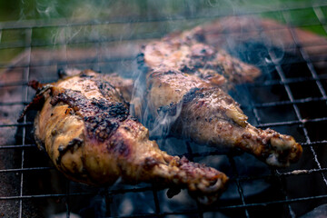 Chicken Legs Roasted On The Hot Flaming Charcoal Grill, Top View Close Up