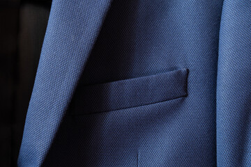 High resolution with details and quality shot of formal dark blue wool suit fabric texture. with...