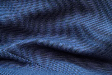 High resolution with details and quality shot of formal dark blue wool suit fabric texture. with...