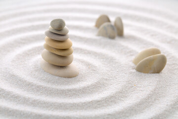 Seven balancing stones. Japanese zen garden meditation for concentration and relaxation sand for harmony and balance in pure simplicity - macro lens shot.