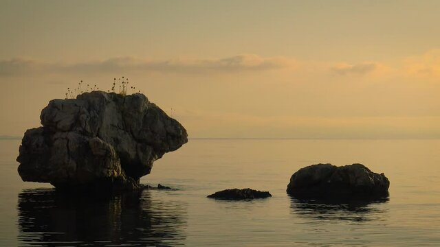 Sunset over the calm Mediterranean sea, Corfu, Greece