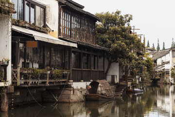 Fototapeta na wymiar Canal and old houses in Zhujiajiao water town in Shanghai
