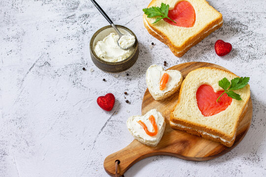 Breakfast for valentine's day or mother's day, toast with salmon and curd cheese with the inscription that I love you. Copy space.
