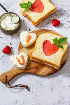 Breakfast for valentine's day or mother's day, toast with salmon and curd cheese with the inscription that I love you. Copy space.