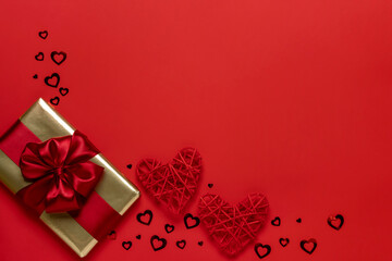 Valentine's day gift on a red background. Valentine's day concept. Copy of space. View from above.