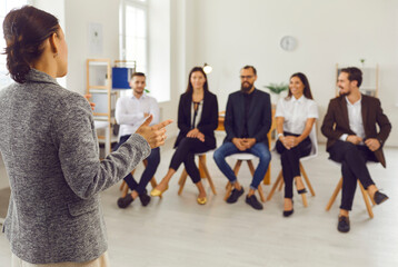 Office workers listening to executive manager's presentation during corporate staff training