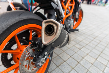 Sport motor bike. Rear wheel and exhaust system.