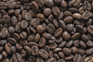 Brown coffee beans texture. Nice  background for designers project.