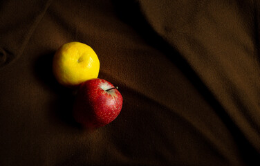 Fresh fruits placed on a brown background
