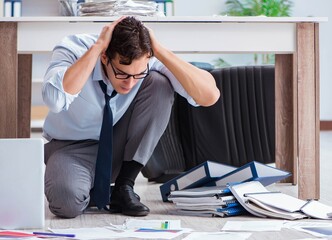 Bankrupt businessman angry in the office floor